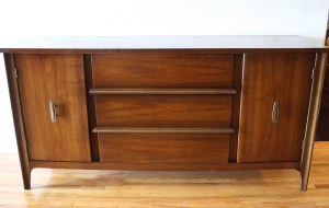 mcm credenza with brass handles and streamlined drawers 1