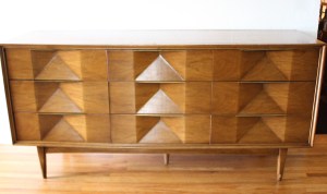 mcm sculpted low dresser with angled concave design 1