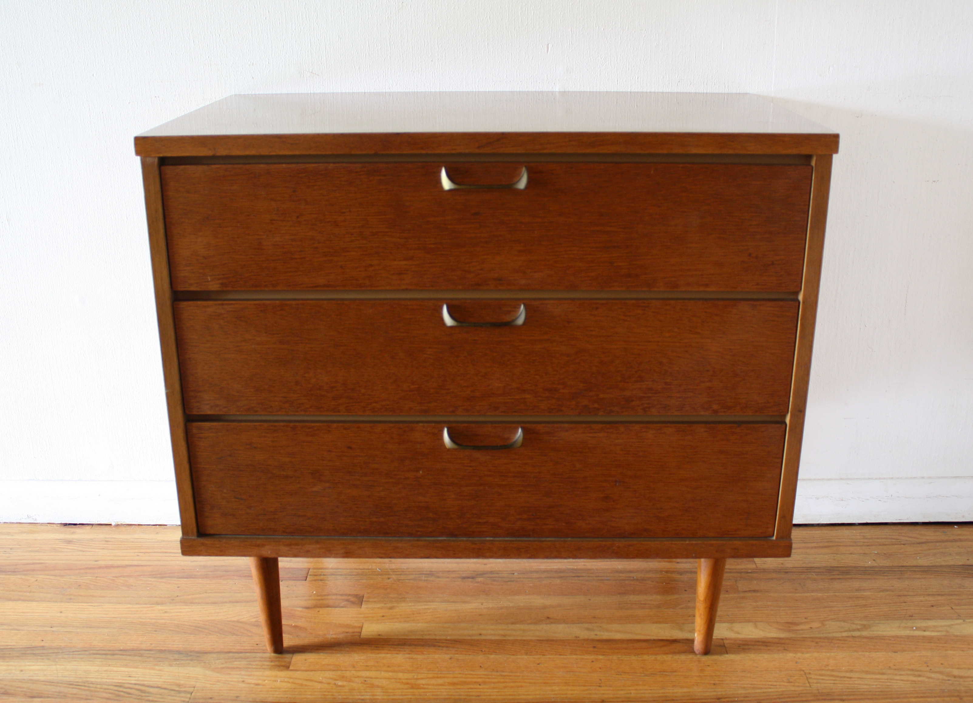 mcm bachelor dresser with sculpted brass handles 1
